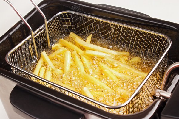 bigstock-Cooking-french-fries-48727343