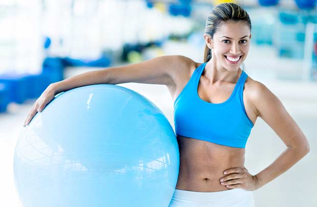 bigstock-Happy-woman-at-the-gym-holding-47205949