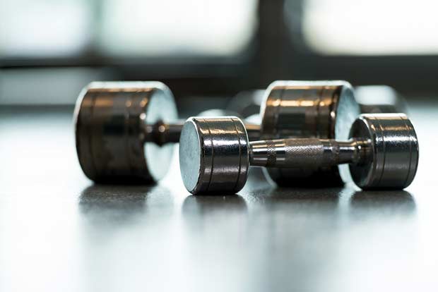 bigstock-Dumbbells-On-Floor-49016288