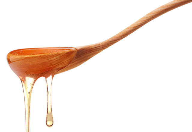 bigstock-Honey-dripping-from-a-wooden-h-50209211