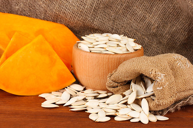 bigstock-Pumpkin-seeds-in-sack-on-wood-41365330