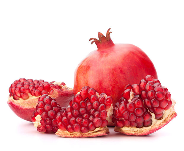 bigstock-Ripe-pomegranate-fruit-isolate-38718574