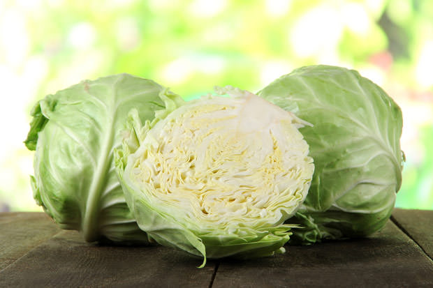 bigstock-Cabbage-on-wooden-table-on-nat-47881445