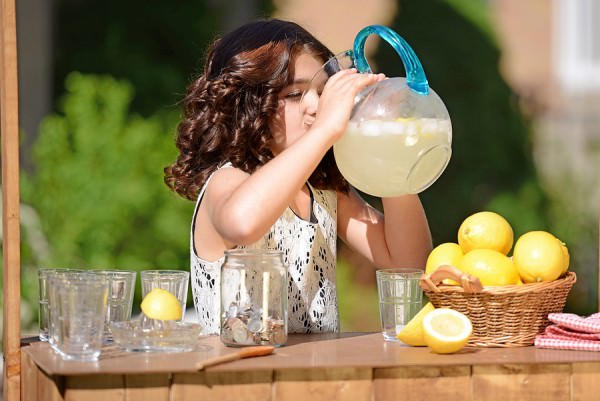 bigstock-little-girl-drinking-from-lemo-46954579