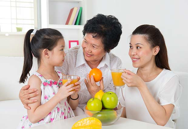 bigstock-Asian-family-drinking-orange-j-46656235