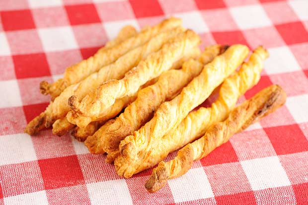 bigstock-Cheese-twists-pastry-over-red--32035277