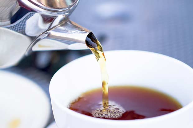 bigstock-Pouring-Hot-Tea-From-Restauran-28475924