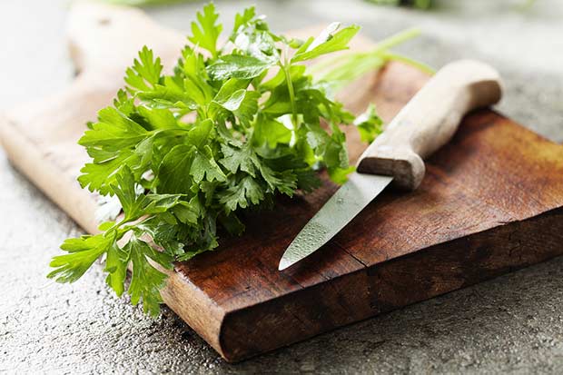 bigstock-bunch-of-fresh-parsley-on-a-wo-50260577