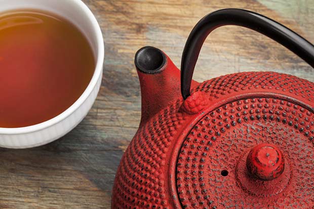 bigstock-red-tetsubin-with-a-cup-of-tea-48998345