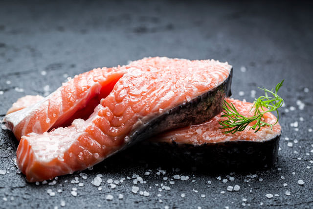 Fresh raw salmon with coarse salt