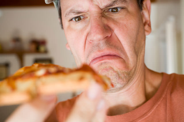 Man Eating Pepperoni Pizza