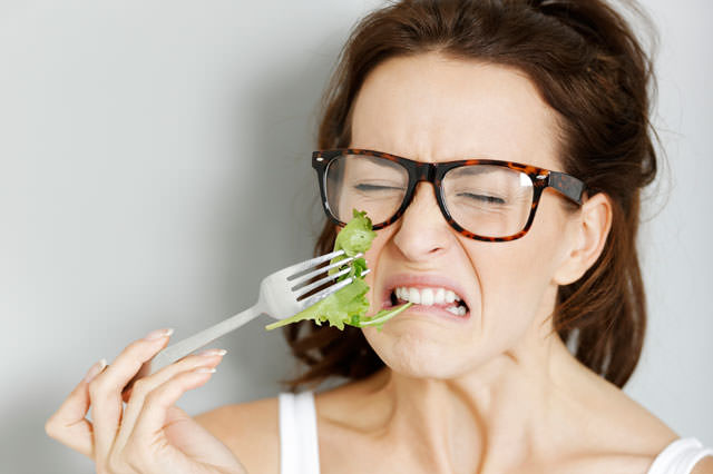 Woman eating fresh salad