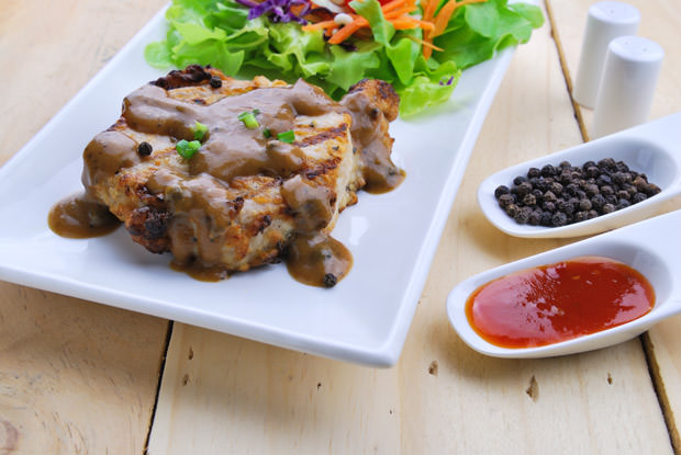 Grilled steaks, pork with pepper gravy and vegetable salad