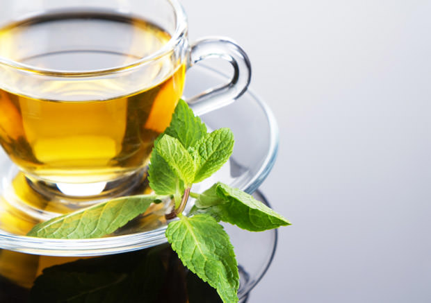 Tea cup with fresh mint leaves